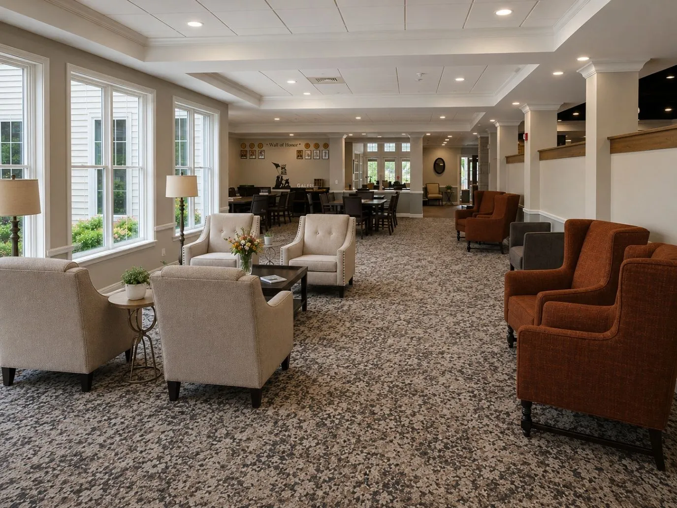 Sunlit Saddlebrook lounge with comfortable chairs and views through the community