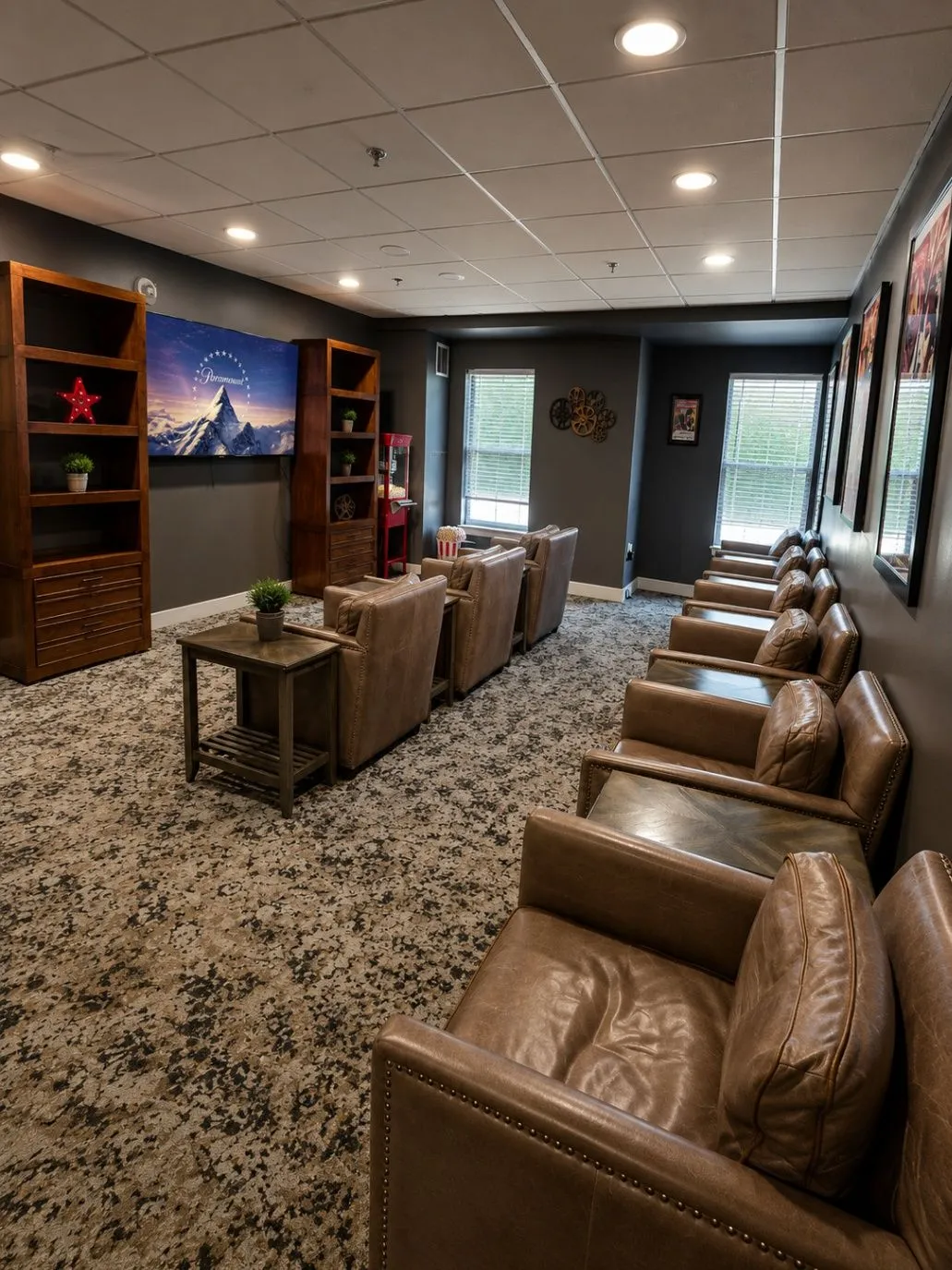 Saddlebrook sitting room with armchairs, bookshelves, and soft evening light